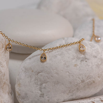 Gold-plated 925 sterling silver chain bracelet with five dangling drop-shaped clear zircon stones