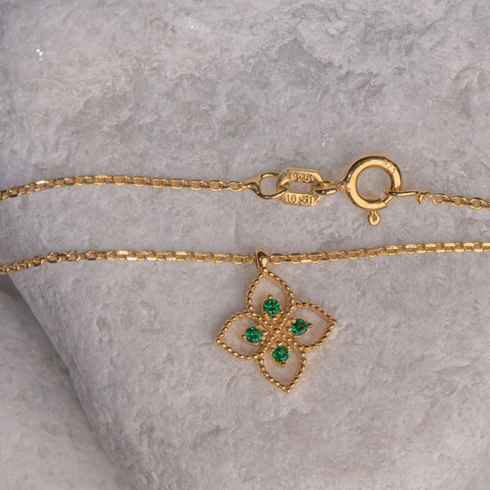 Gold-plated 925 sterling silver pendant necklace with flower-shaped motif and four green zircon stones
