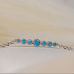 925 sterling silver chain bracelet with graduated central motif of blue zircon stones